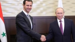 Assad (li.) und Putin in besseren Zeiten (Bild: AFP)