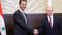 Assad (li.) und Putin in besseren Zeiten (Bild: AFP)