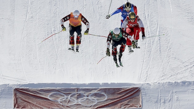 Dave Duncan, Kevin Drury, Arnaud Bovolenta und Sergey Ridzik (von links nach rechts) im olympischen Ski-Cross-Semifinale. (Bild: AP)