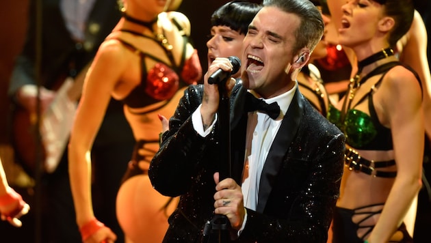 Robbie Williams begeistert im kommenden Jahr gleich dreimal seine Fans in Österreich (Bild: AFP)