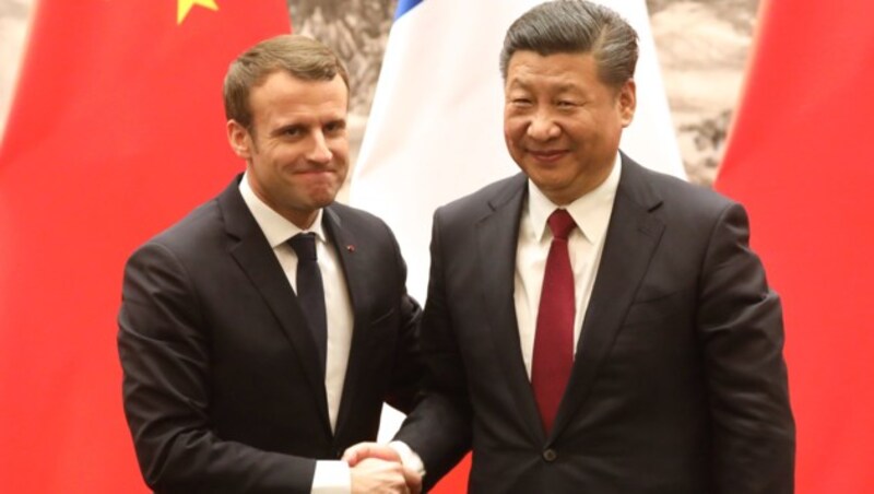 Frankreichs Präsident Emmanuel Macron zu Besuch bei Chinas Präsident Xi Jinping (Bild: AFP)