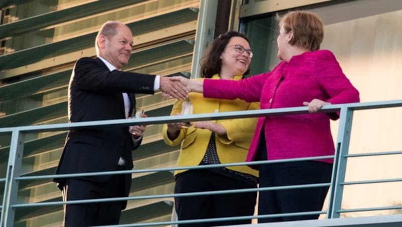 Olaf Scholz, Andrea Nahles und Angela Merkel (Bild: AFP)