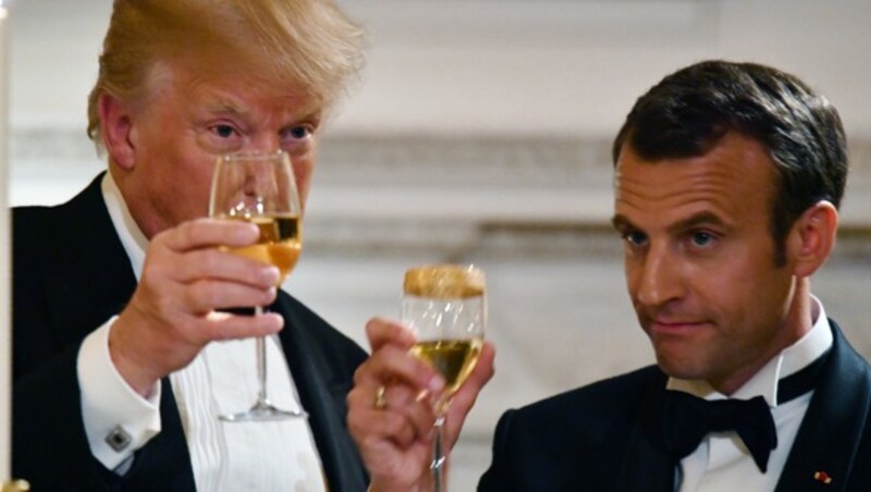 Gastgeber Donald Trump und sein französischer Amtskollege Emmanuel Macron während eines Staatsbanketts im April des Vorjahres (Bild: APA/AFP/Nicholas Kamm)