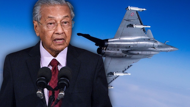 Malaysias Premier Mahathir Mohamad (hier im Bild mit einem französischen Mehrzweckkampfflugzeug Rafale) mit einer milliardenschweren Drohung gegen die EU (Bild: AFP, krone.at-Grafik)