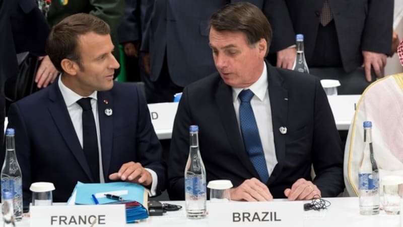 Frankreichs Präsident Emmanuel Macron und sein brasilianischer Amtskollege Jair Bolsonaro beim G20-Gipfel in Japan (Bild: AFP)