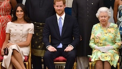 Herzogin Meghan, Prinz Harry und Queen Elizabeth (Bild: AFP)