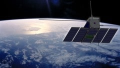 Künstlerische Illustration: Der Nanosatellit OPS-SAT im Erdorbit (Bild: ESA)