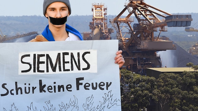 Ein Klimaschutzaktivist demonstriert vor der Siemens-Zentrale in München gegen den Kohlebergwerk-Auftrag in Australien. (Bild: APA/AFP/DPA/Tobias Hase, AFP, krone.at-Grafik)