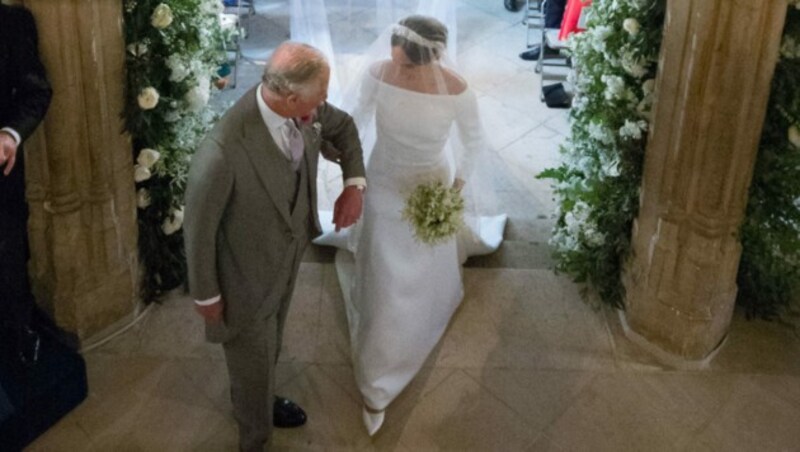 Charles führte Meghan einst zum Altar, jetzt schwänzt sie seine Krönung. (Bild: AFP)