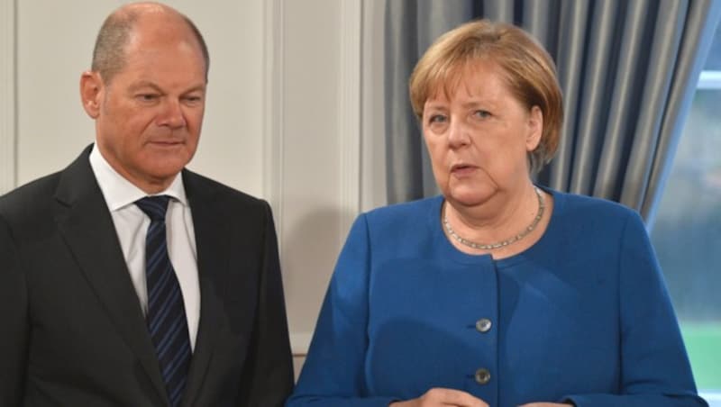 Deutschlands Finanzminister und Vizekanzler Olaf Scholz mit Bundeskanzlerin Angela Merkel (Bild: AFP)