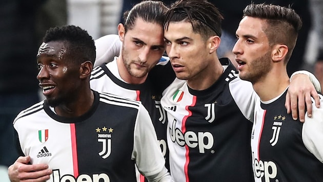 Blaise Matuidi (li.) mit seinen Juventus-Teamkollegen (Bild: AFP)