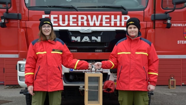 Paul Ribits und Iris Milalkovits sind nur zwei von vielen Feuerwehrleuten, die das Licht auch heuer bringen. (Bild: BFKO Eisenstadt Umgebung)