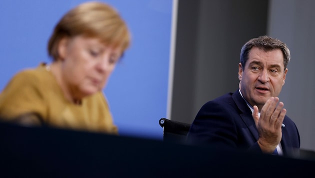 Die Parteien von Kanzlerin Angela Merkel (CDU) und Bayerns Ministerpräsidenten Markus Söder (CSU) haben seit Tagen mit Korruptionsvorwürfen gegen einzelne Abgeordnete zu kämpfen. (Bild: APA/AFP/Pool/Odd Andersen)