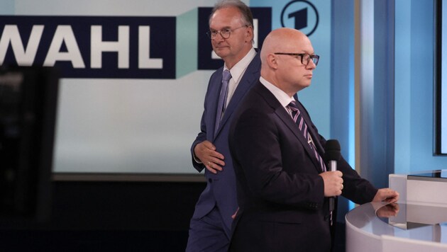 Links der große Wahlsieger Reiner Haseloff von der CDU, rechts AfD-Spitzenkandidat Oliver Kirchner (Bild: AFP)