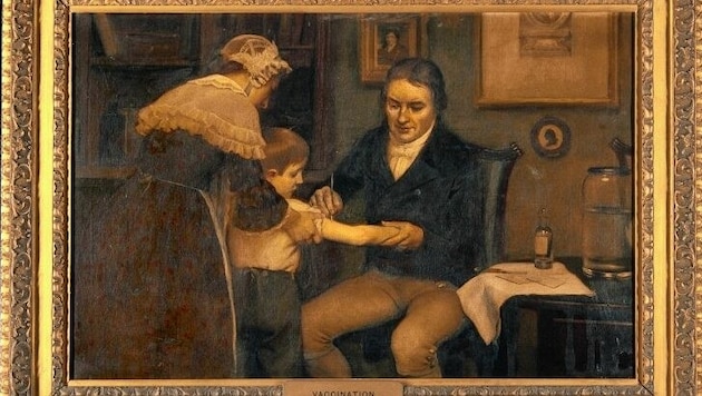 Edward Jenner bei der ersten Impfung gegen Pocken, die er bei einem achtjährigen Buben durchgeführt hat. (Bild: Wikipedia)