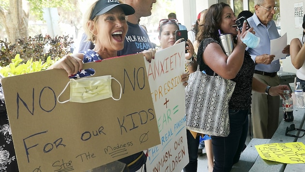Protest gegen Schutzmasken in Florida (Bild: AP)