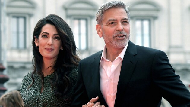 Amal und George Clooney (Bild: APA/Photo by Tiziana FABI/AFP)