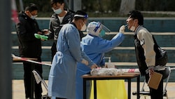 Corona-Tests in Peking (Bild: AFP)