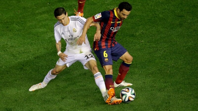 Di Maria (l.), Xavi (r.) (Bild: AFP)