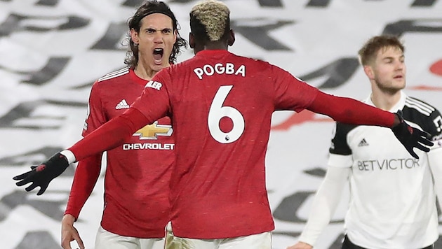 Edinson Cavani (li.) und Paul Pogba verlassen Manchester United. (Bild: APA/AFP/POOL/PETER CZIBORRA)