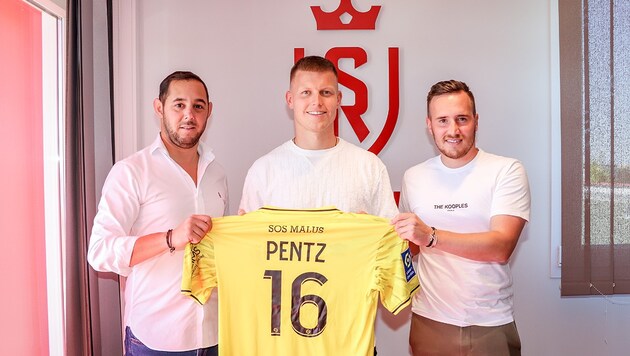 Patrick Pentz (M.) trägt bei Stade Reims die 16, wird aber die Nummer 1 im Tor der Franzosen. (Bild: Stade Reims)