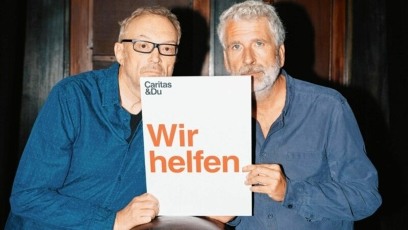 Auch die Kabarettisten Josef Hader und Dirk Stermann unterstützen die Aktion mit ihrem Klimabonus. (Bild: Caritas)