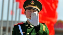 Chinesische Beamte, die Dissidenten in Europa verfolgen? Die Vorwürfe sind schwerwiegend, China dementiert. (Bild: AFP/TEH ENG KOON)