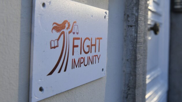Das Logo der NGO „Fight Impunity“ (Bild: AFP)