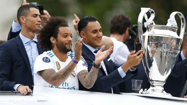 Cristiano Ronaldo (links) und Keylor Navas (3.v.l.) beim Champions-League-Triump 2018 (Bild: AFP or licensors)