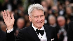 Harrison Ford wurde für sein Lebenswerk im Rahmen der Premiere des fünften „Indiana Jones“-Films ausgezeichnet. (Bild: APA/AFP/LOIC VENANCE)