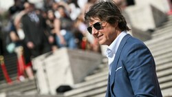 Tom Cruise macht nicht nur für „Mission: Impossible“ Werbung, sondern auch für die Konkurrenz im Kino. (Bild: APA/AFP/Tiziana FABI)