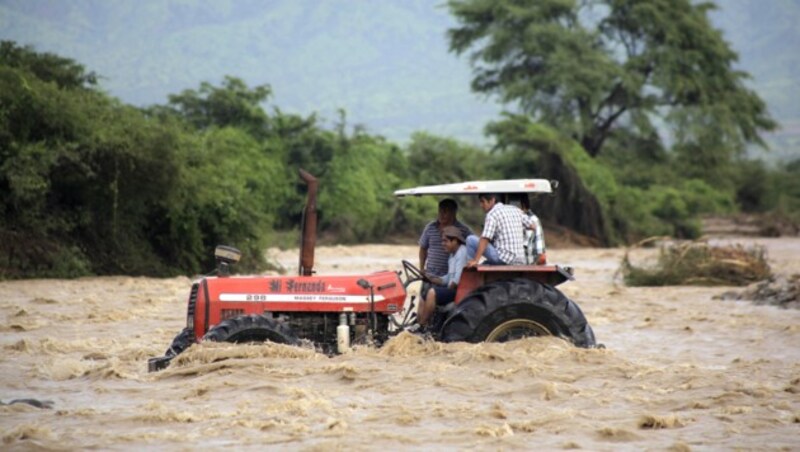 Zu den globalen Auswirkungen zählen immer wieder Überschwemmungen (Archivbild). (Bild: APA/AFP/Julio REANO)