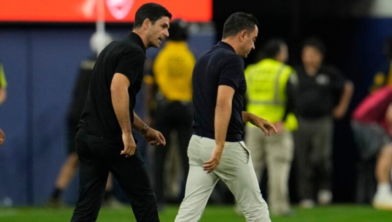 Mikel Arteta (l.) und Xavi (Bild: AFP/GETTY IMAGES/KEVORK)