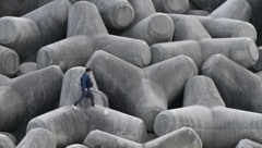Beton ist aufgrund des hohen Energiebedarfs bei der Produktion zuletzt in Verruf geraten, künftig könnte er aber einen Imagewandel vollziehen. (Bild: APA/AFP/Anthony WALLACE)