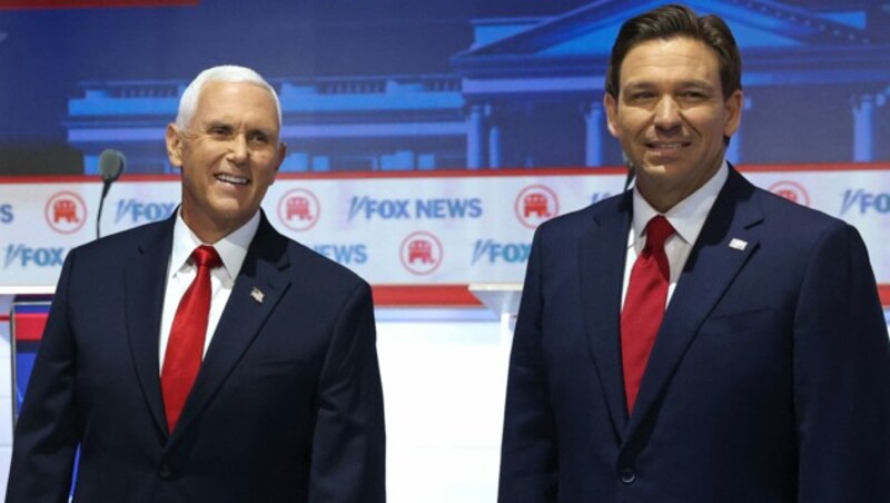 Mike Pence (li.) und Ron DeSantis (Bild: AFP)