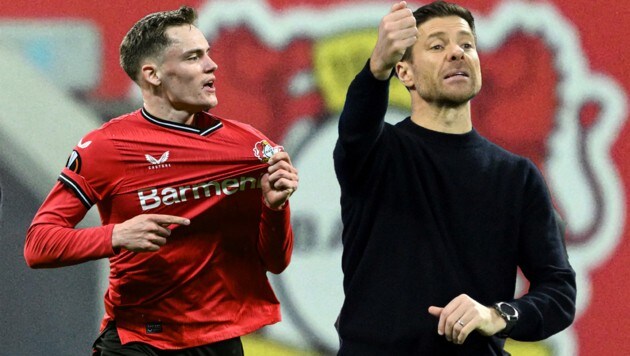 Wie lange hält Florian Wirtz (links) noch das Leverkusen-Wappen hoch? Und lässt er sich künftig (trotzdem) von Xabi Alonso dirigieren? (Bild: APA/AFP/INA FASSBENDER)