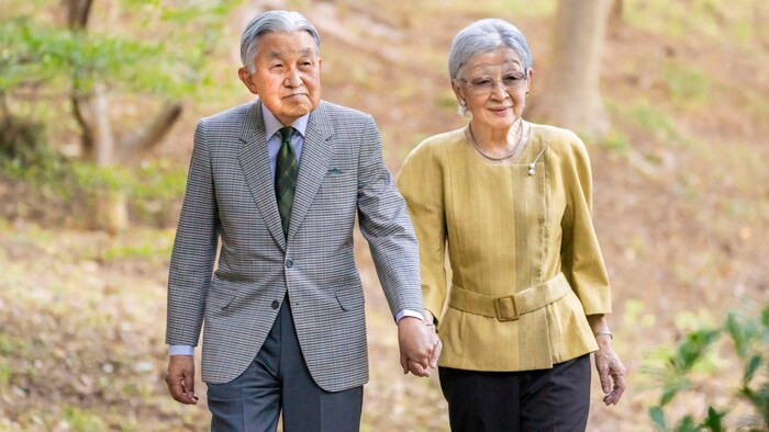 Former Japanese Emperor Akihito on a walk with his wife Michiko in October 2023