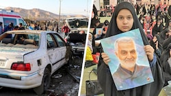 Eine junge Iranerin (re.) hält ein Bild des mächtigen Generals Ghassem Soleimani in die Höhe. Bei zwei Explosionen bei einer Gedenkfeier für ihn im Iran kamen am Mittwoch mehr als 100 Menschen ums Leben. (Bild: AP APA/AFP/TASNIM NEWS Krone KREATIV,)