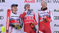 Atle Lie McGrath, Manuel Feller und Dominik Raschner (von li. nach re.) singen auf dem Podium.  (Bild: GEPA pictures)