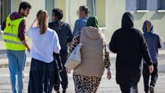 Migrantinnen und Migranten in Deutschland (Bild: AFP)