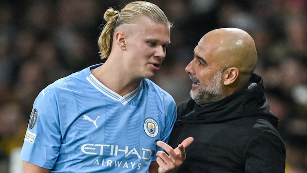 Goalgetter Erling Haaland (li.) und City-Trainer Pep Guardiola