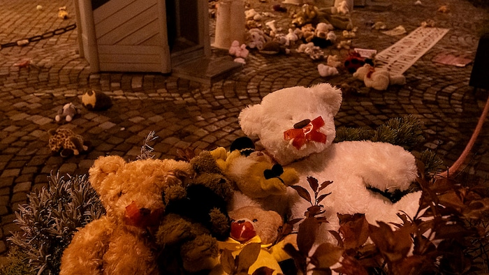 Stuffed animals with taped-up snouts in front of the president's official residence