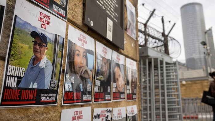 On a wall in Tel Aviv where photos of hostages are hung, "rescued" was scrawled on the picture of Louis Har. 
