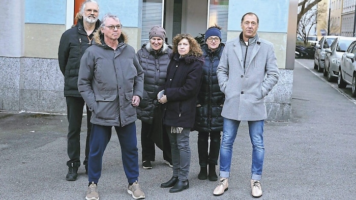 Residents Christian Schneider (right), Renate Domnanich (center) and neighbors in front of the ...