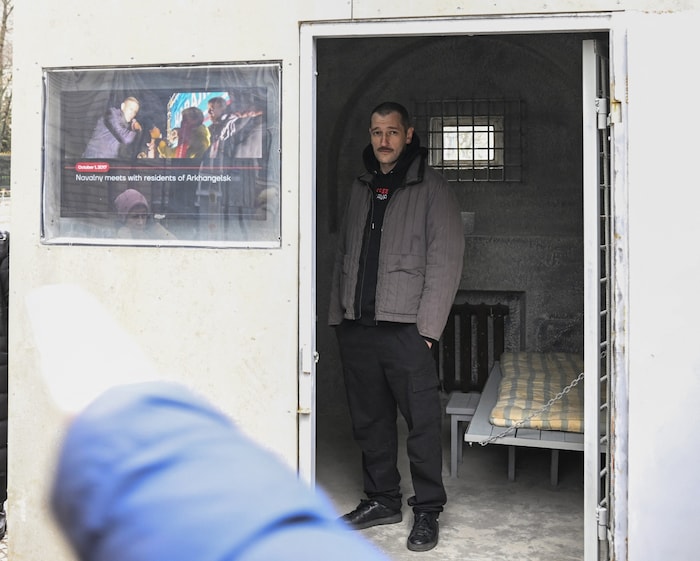 Oleg Navalny in a replica of his brother's prison cell, which was set up by activists outside the Russian embassy in Berlin in January 2023
