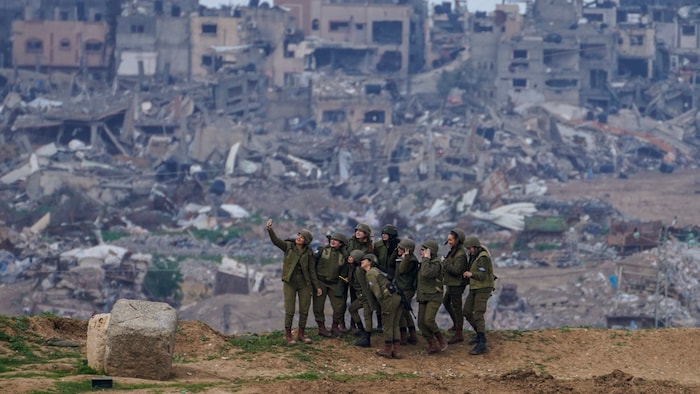 Israeli female soldiers pose for a photo in southern Israel on the border with the Gaza Strip.
