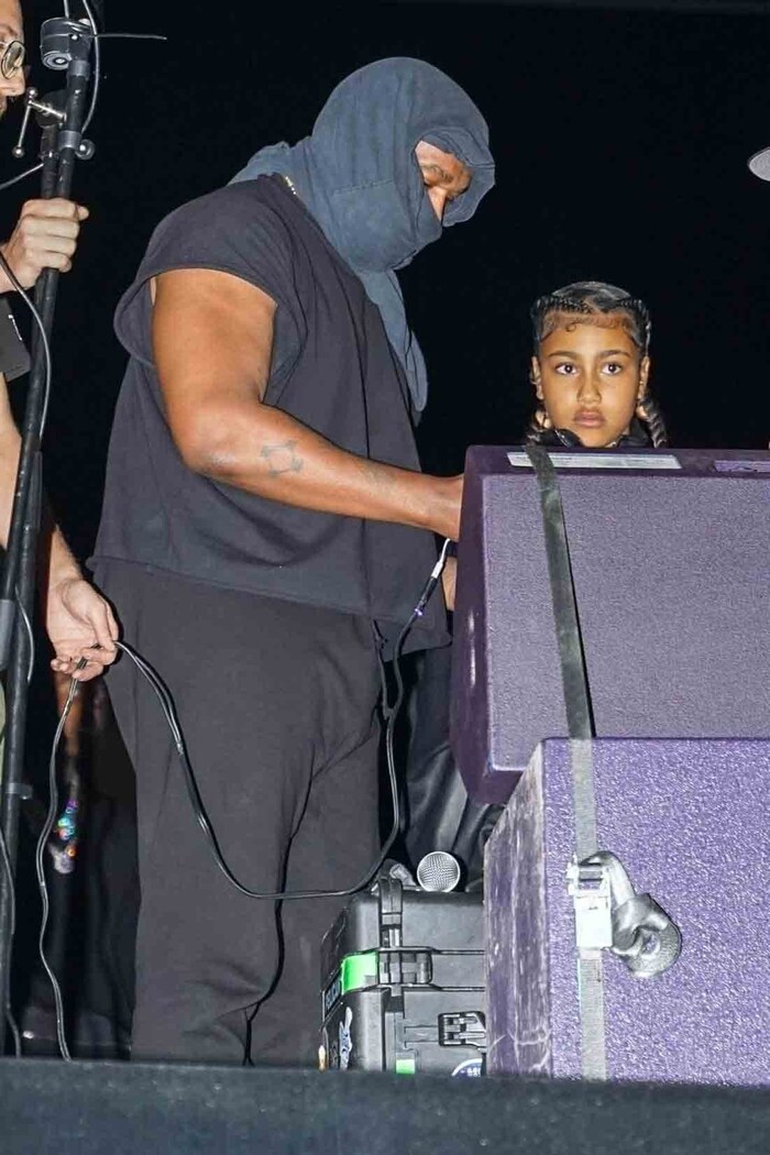 Kanye West and his daughter North at one of his concerts.