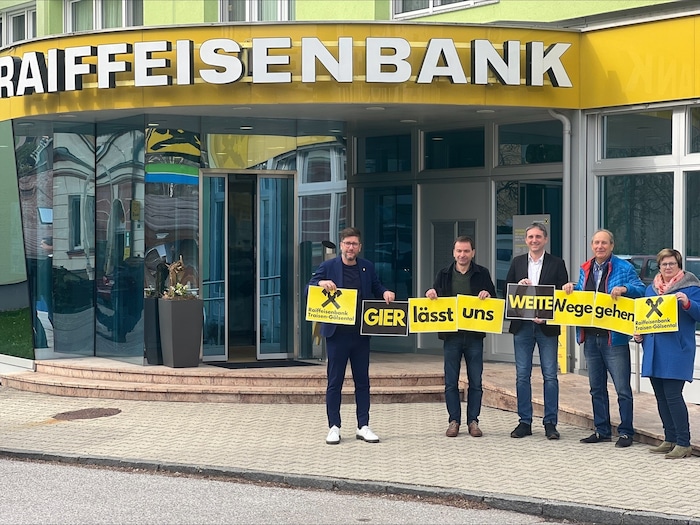 Joint protest in front of a Raiffeisen branch