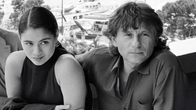 Roman Polanski en el Festival de Cannes en 1986 con la actriz británica Charlotte Lewis. (Bild: APA/AFP)