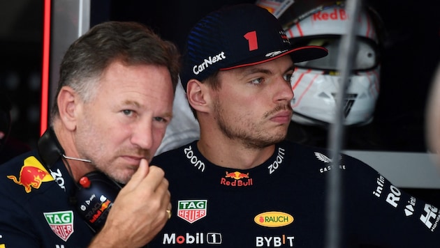 Christian Horner (links) und Max Verstappen (Bild: APA/AFP/Toshifumi KITAMURA)